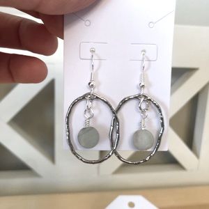 Alloy silver bezel with hand wrapped amazonite stone.